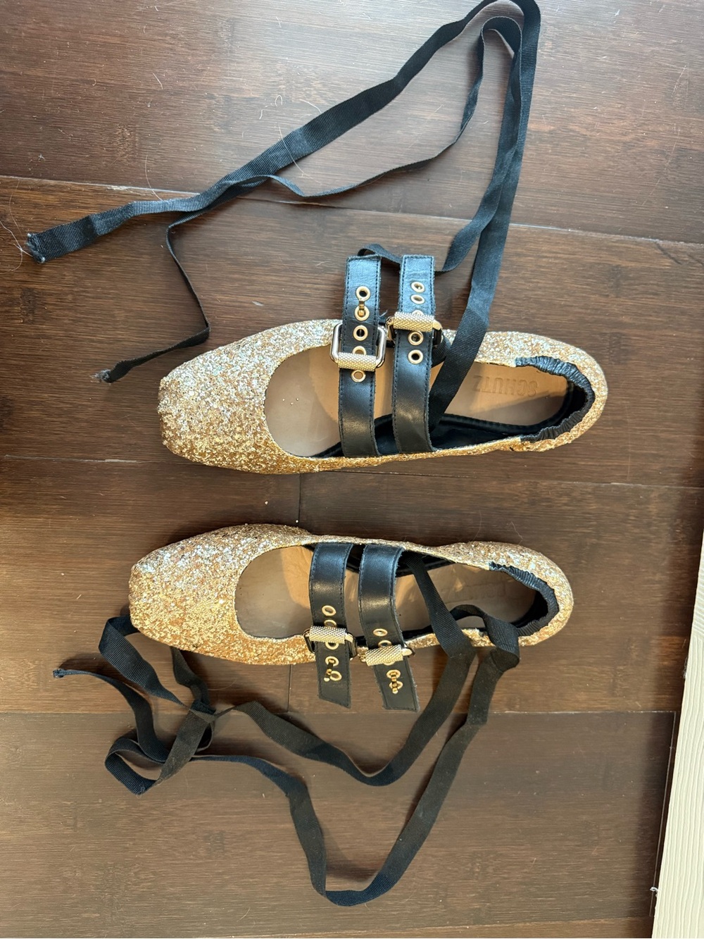 SCHUTZ Gold Glitter Ballet Flats with Black Ribbon and Buckle Straps